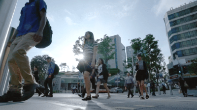 people walking across the street in Singapore | Video Production Agency Singapore