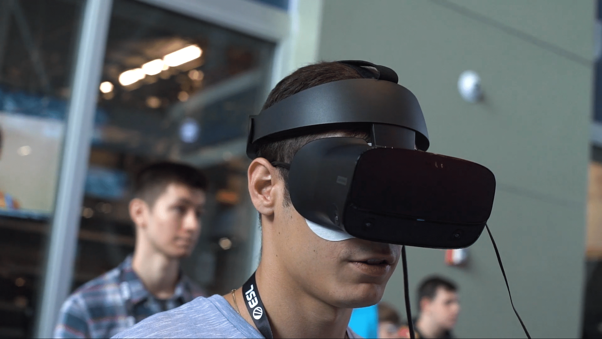 male wearing virtual reality headset at a gaming event